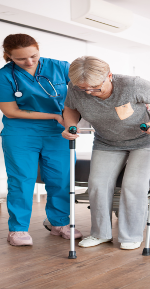 old-woman-nursing-home-walking-with-crutches-with-help-from-female-nurse